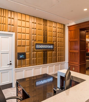 kraemer-design-group-kdg-detroit-eddystone-interior-lobby-wood-paneling-reception-desk-entry-header