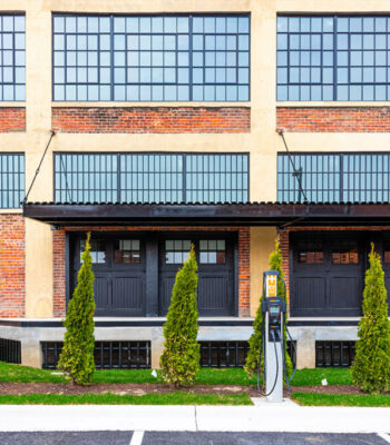 kraemer-design-group-kdg-detroit-toledo-overmyer-building-exterior-apartments-close-ev-charger-brick-black-window-header