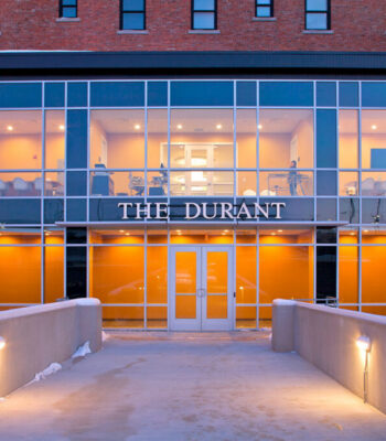 kraemer-design-group-kdg-the-durant-flint-exterior-orange-bridged-entryway-glass-panel-header